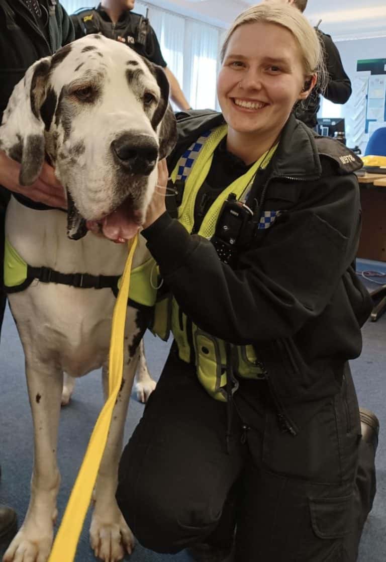 PC Hughes and a therapy dog visiting the station