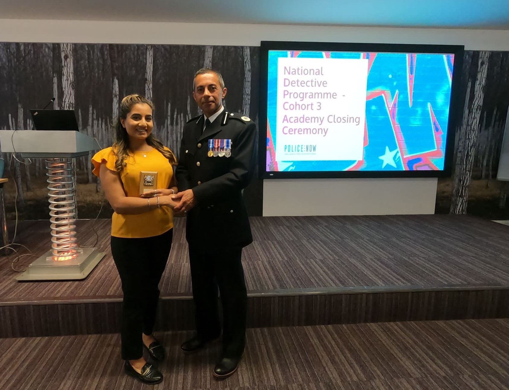 Neeya Gill receiving her award at the academy closing ceremony, with Bedfordshire Police Assistant Chief Constable Sharn Basra